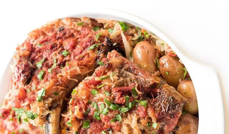 Baked pork chops with sauerkraut and potatoes.