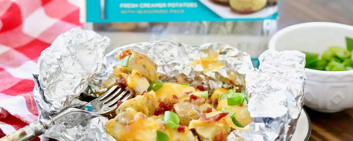 A foil pack dinner with cheese and veggies and Little Potatoes.