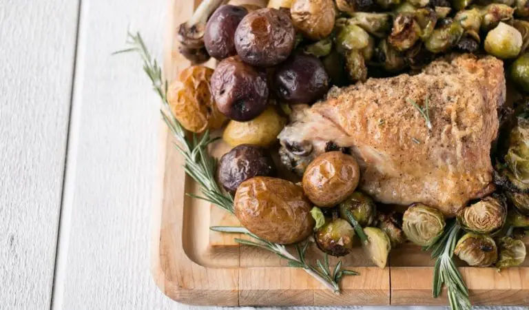 A platter of sheet pan turkey and potatoes.