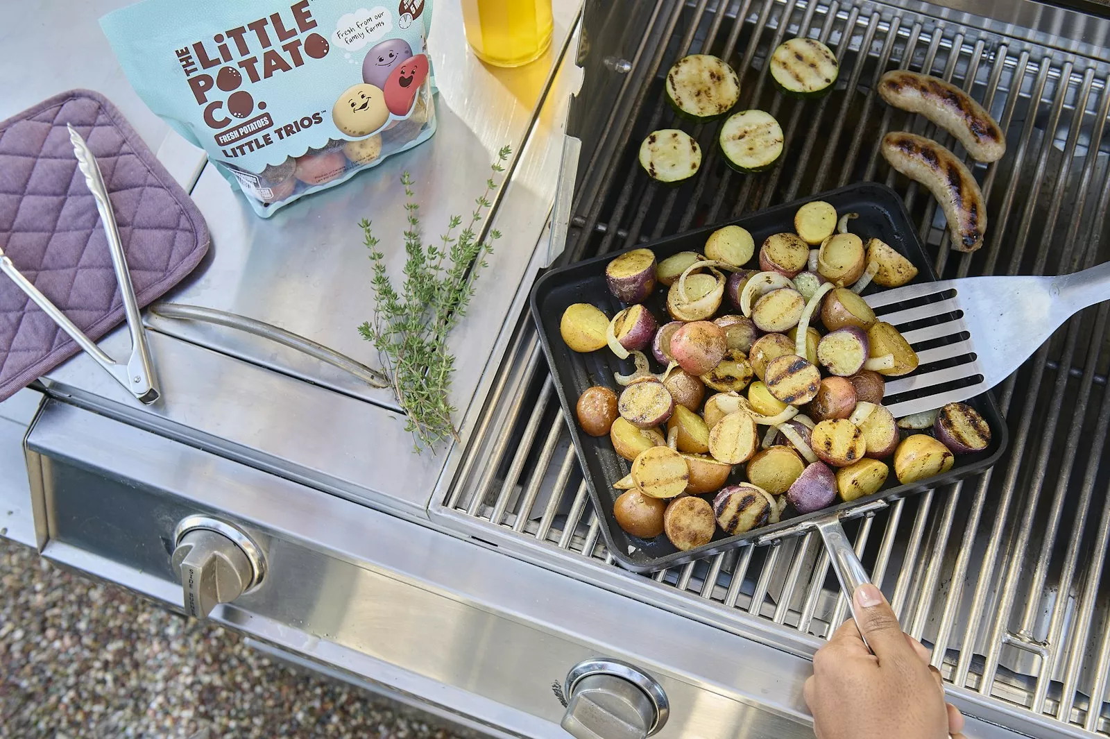 Grilled little potatoes on the grill with other veggies.