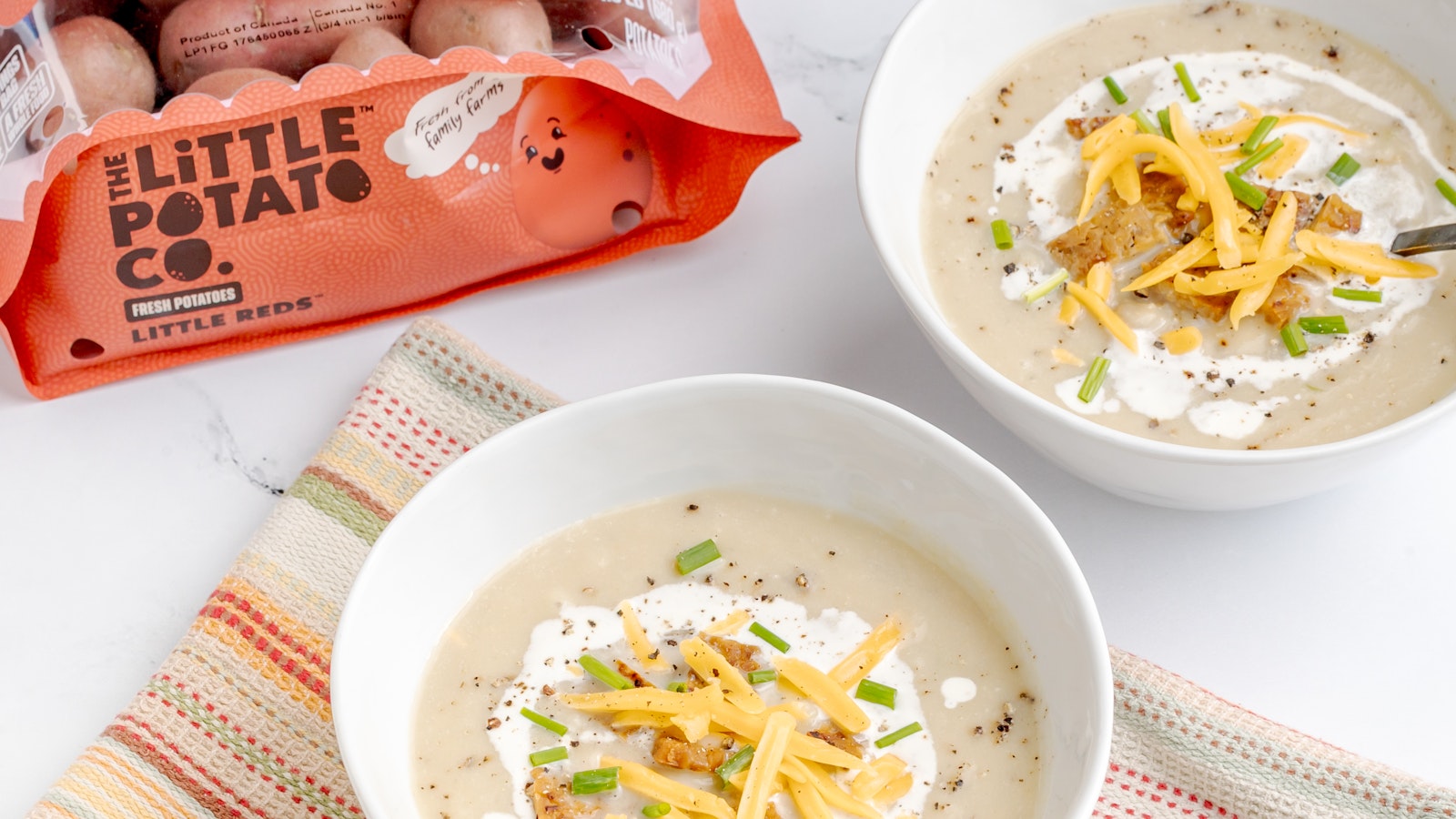 Two bowls of baked Little Potato Soup featuring Little Reds™.
