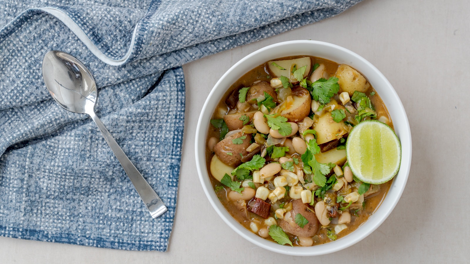 A bowl of green chili potato stew with Little Duos™