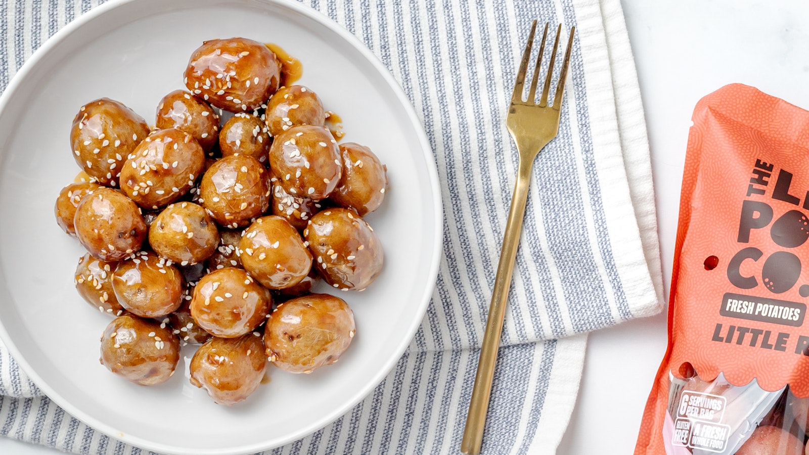 A plate of sticky Little Potatoes made with Little Reds™