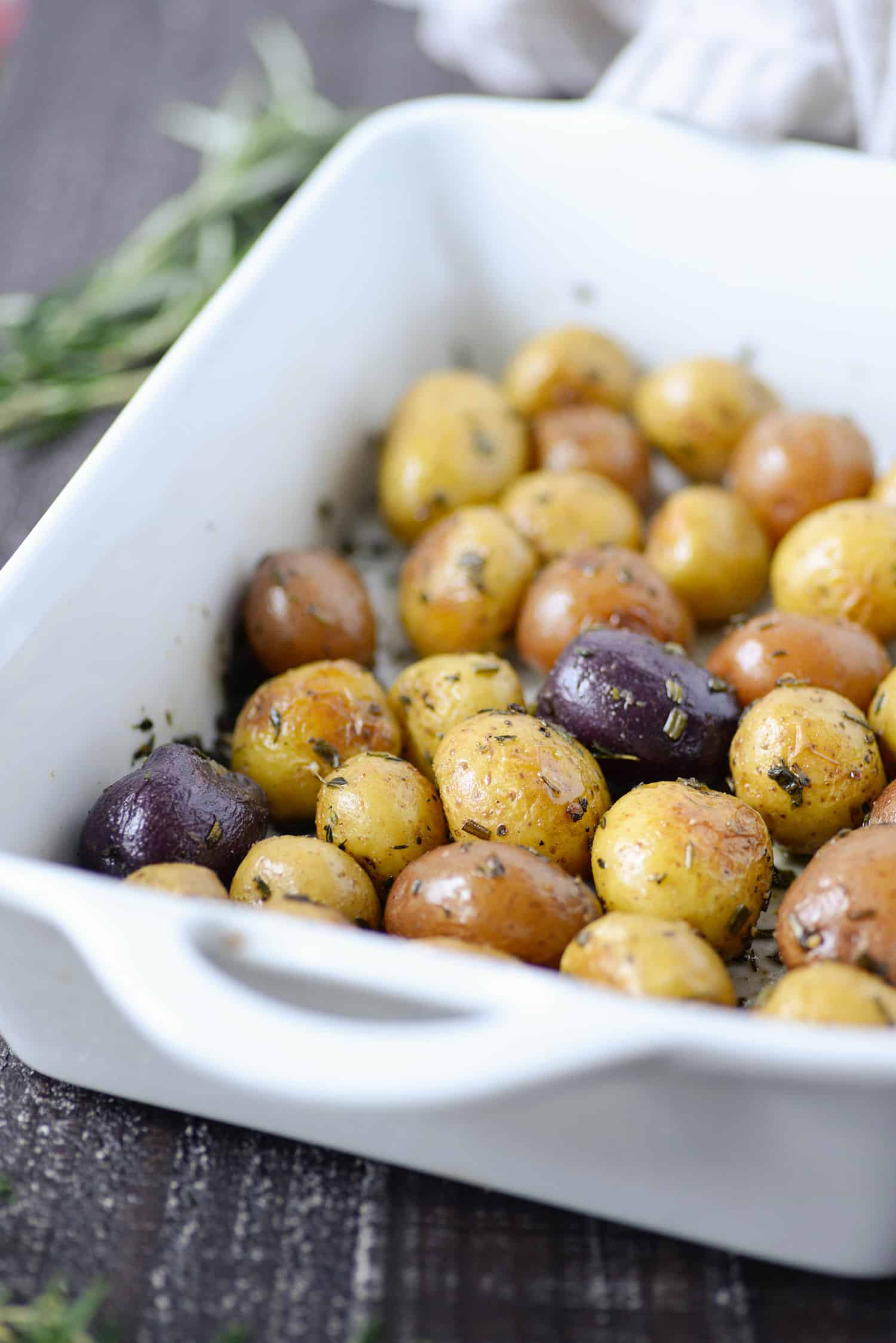 A serving platter of roasted little potatoes.