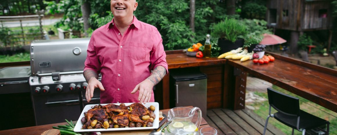 Chef Antoine Sicotte in his backyard with some delicious grilled foods.