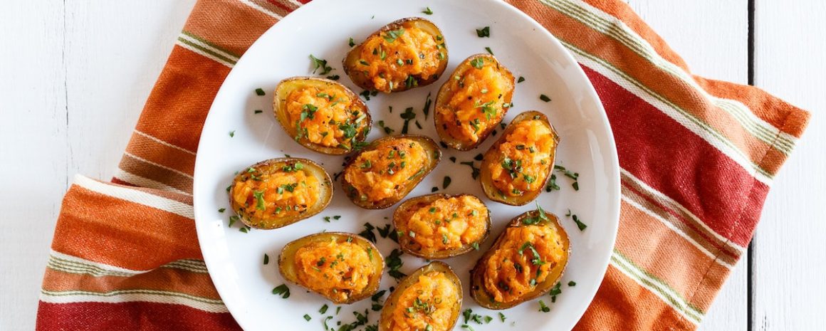 A plate of vegan double stuffed buffalo ranch potatoes.