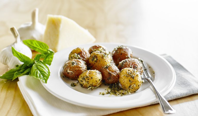 A plate of pesto Parmesan roasted potatoes.