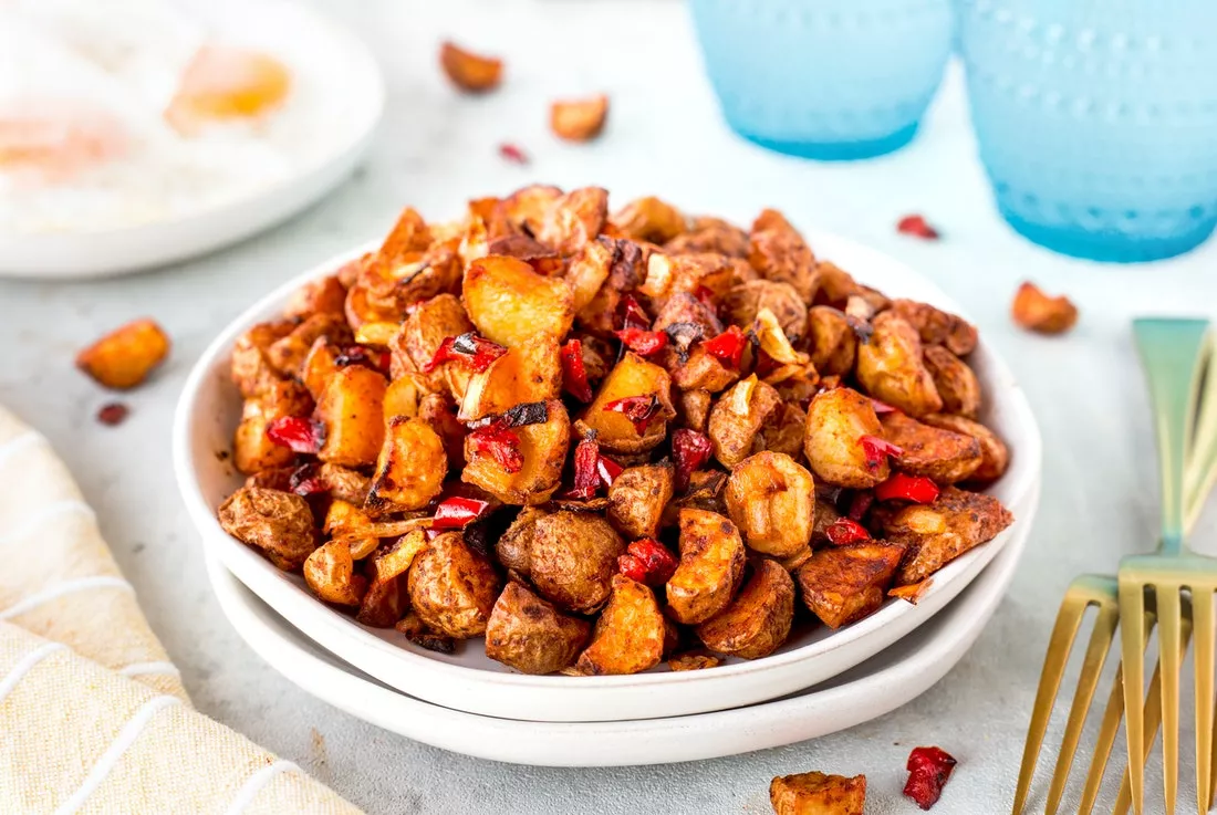 A bowl of Air Fryer home fries made with crispy little potatoes.