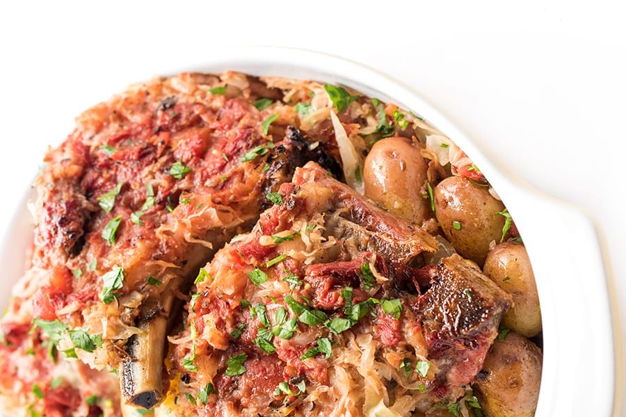 Baked pork chops with sauerkraut and potatoes.