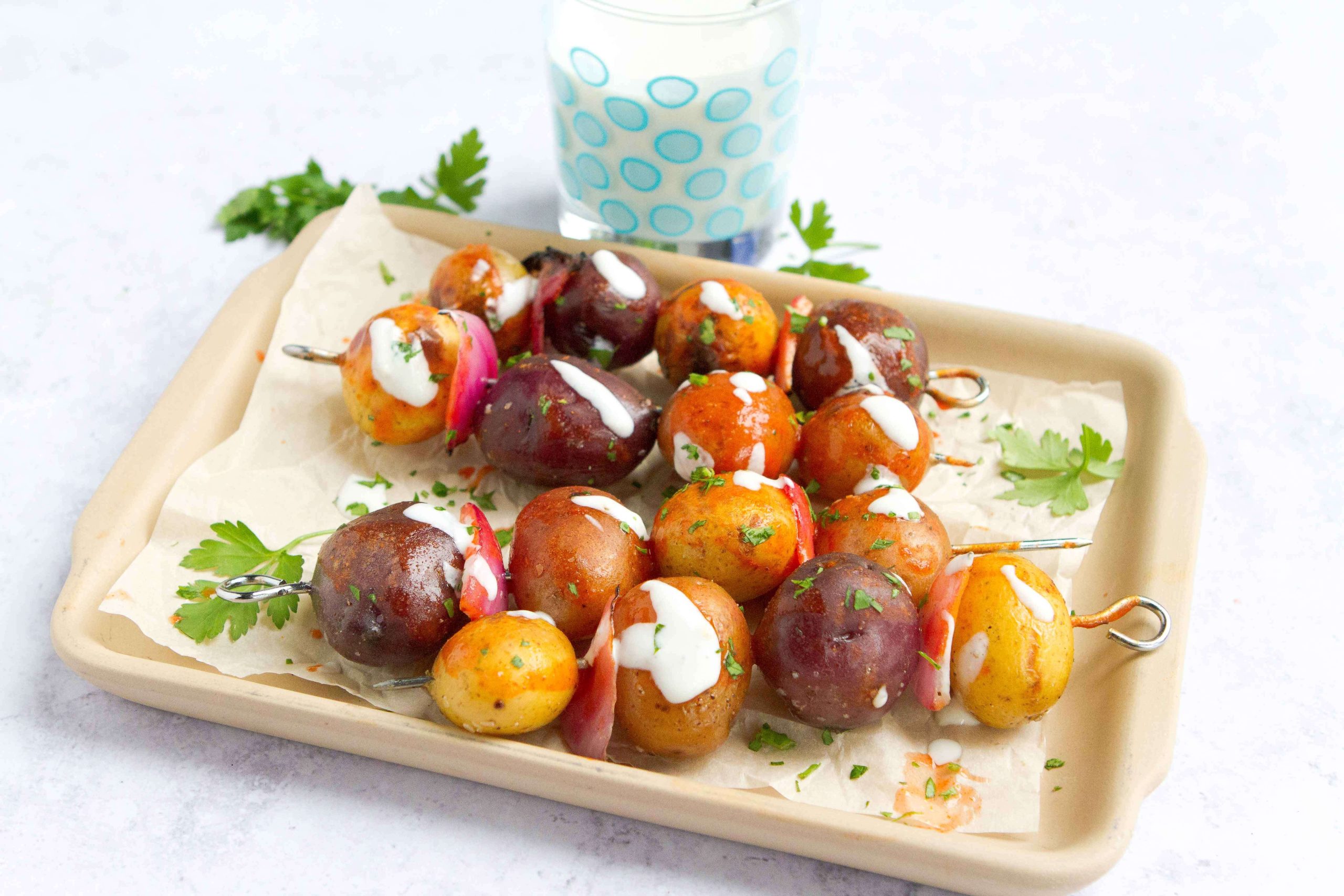 A plate of buffalo grilled potato skewers.