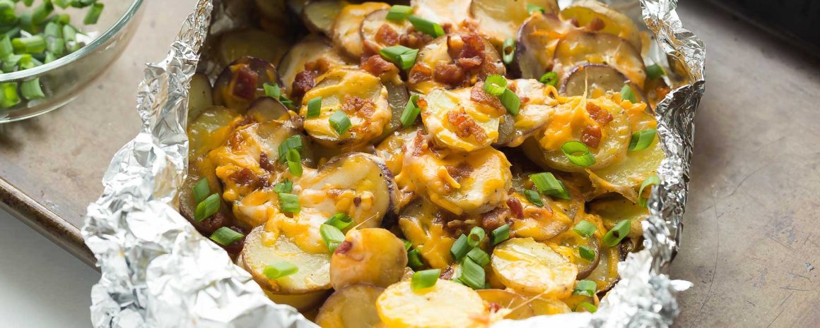Cheesy grilled potatoes with bacon.
