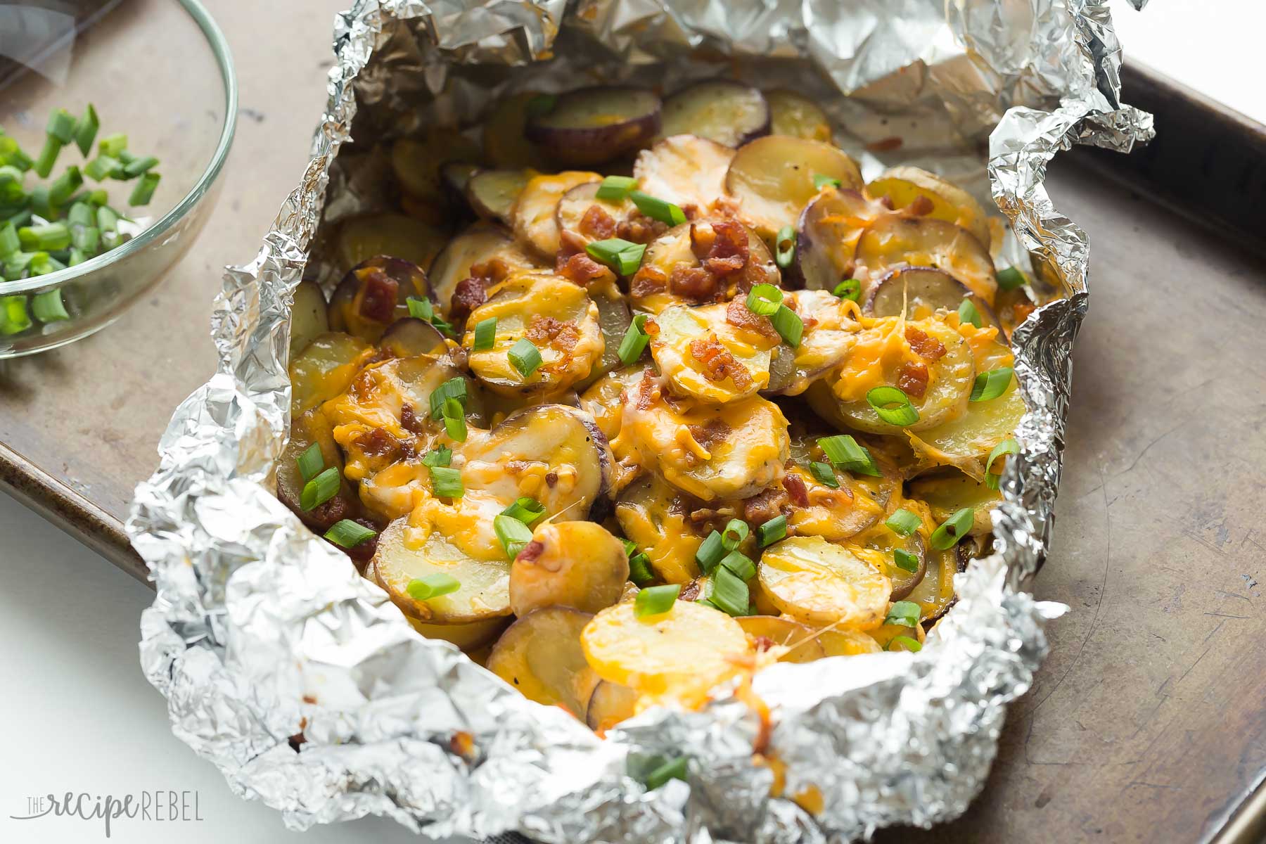 Cheesy grilled potatoes with bacon.