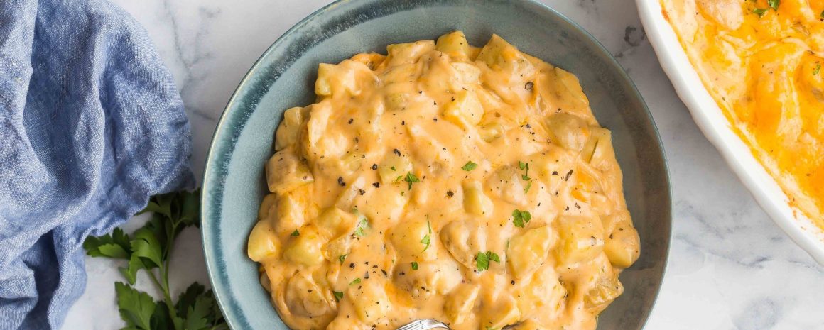 A bowl of cheesy potato casserole. The cheesiest you've ever had.