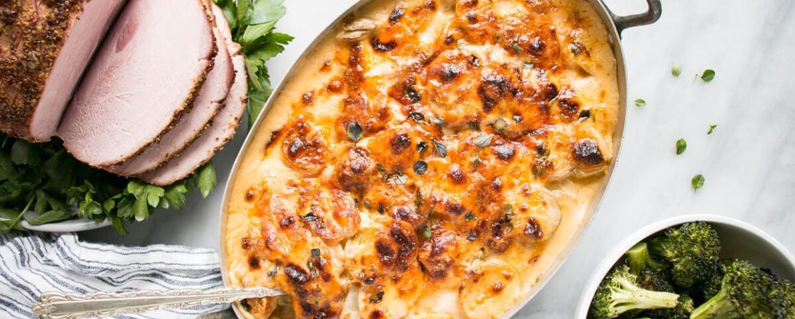 Classic scalloped potatoes in a baking dish.