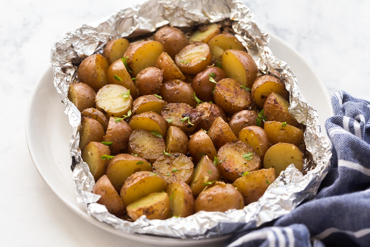 A foil pack filled with crispy on the outside, creamy on the inside delicious Little Potatoes