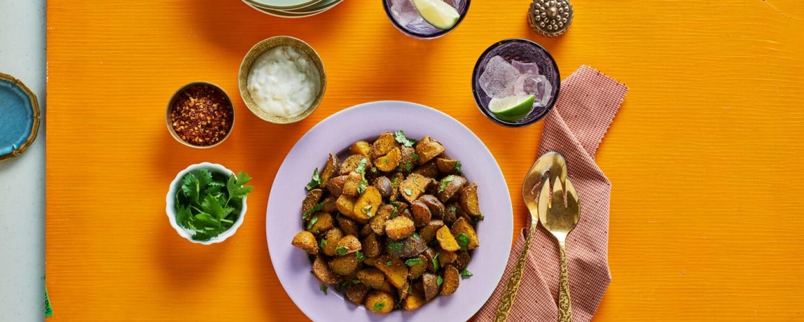 A bowl of garam masala and curry pan-fried potatoes.