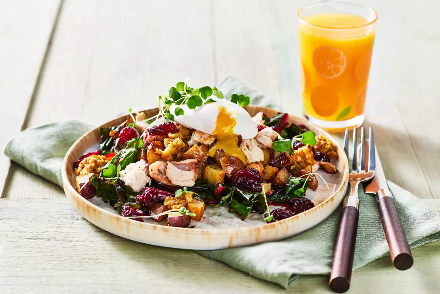 Festive holiday brunch spread featuring Little Potatoes, eggs, and breakfast sides arranged on a table with seasonal decor.