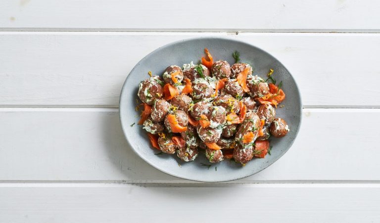 Smoked salmon lox roasted potatoes in a nice little platter.