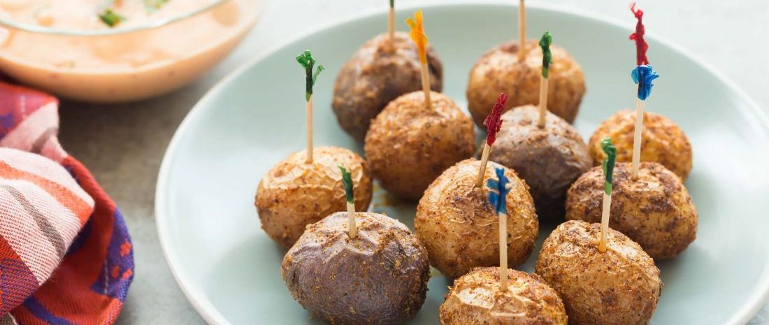 Roasted Little Potatoes with toothpicks in them.