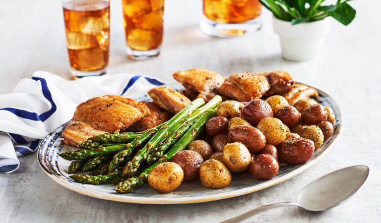 One pan chicken thighs and potatoes with a little asparagus on the side.