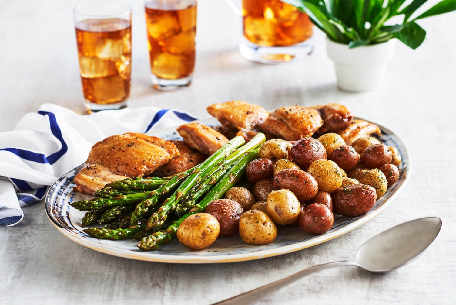 One pan chicken thighs and potatoes with a little asparagus on the side.