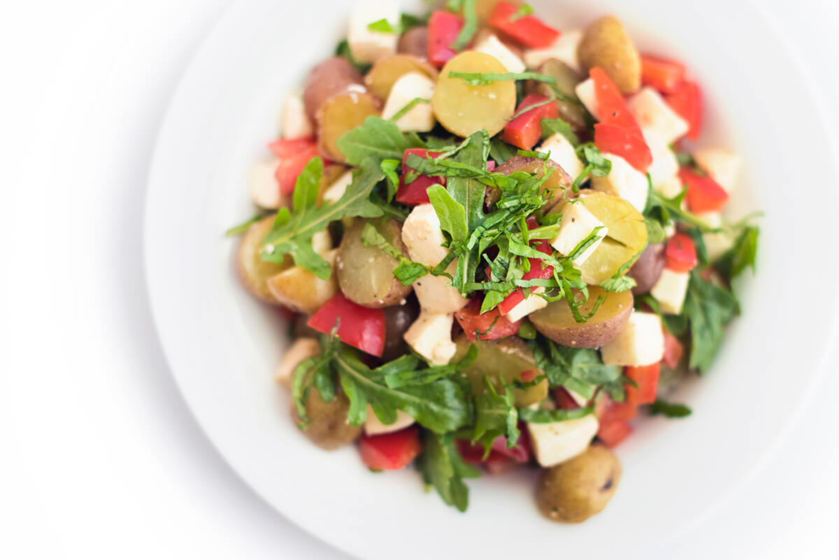 A bowl of potato caprese salad.