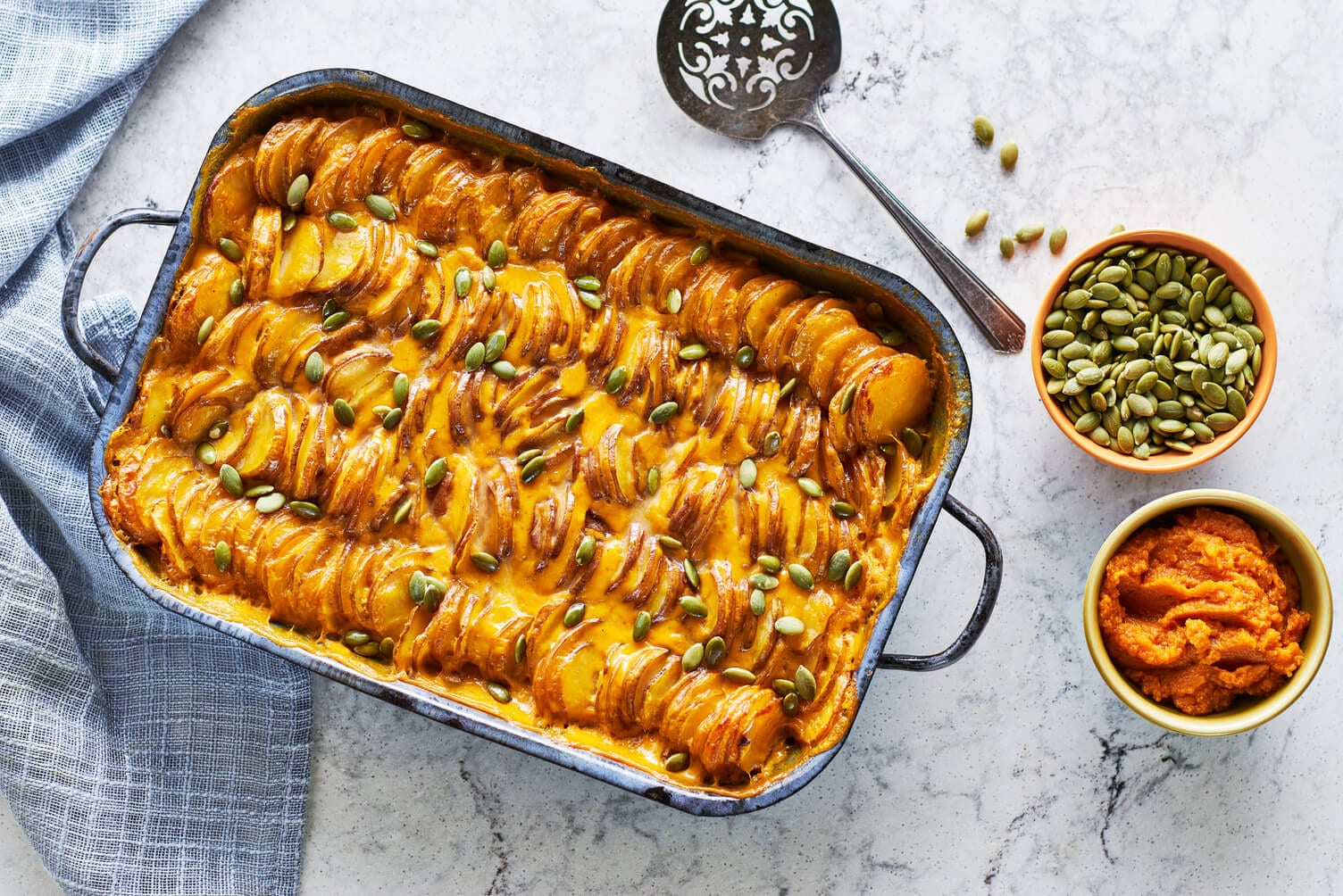 A nice baking dish of pumpkin scalloped potatoes.