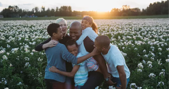 Angela and her family in the field.