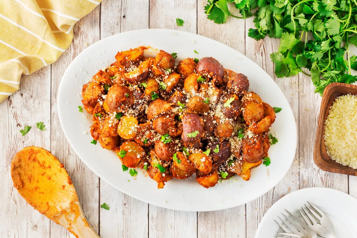 A plate of red pesto little potatoes.