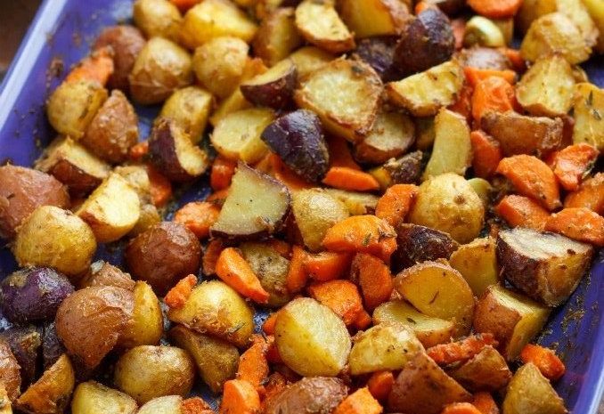 A baking tray of roasted Dijon potatoes.