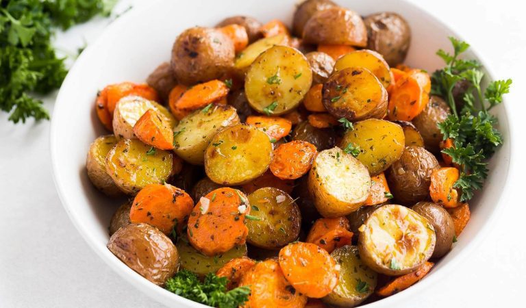 A bowl of roasted potatoes and carrots.