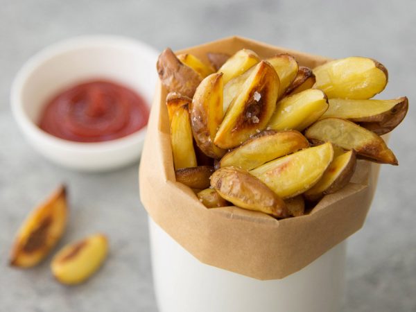 Salt and vinegar potatoes in a cup.