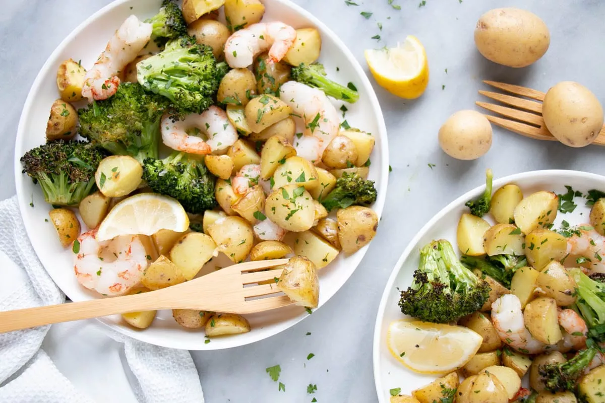 Sheet-Pan-Shrimp-and-Potatoes_Samantha-Gutmanis_Web-Res-3 Sheet pan shrimp and potatoes in little plates with cute wooden forks.