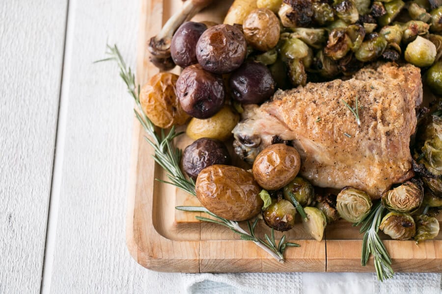 A platter of sheet pan turkey and potatoes.