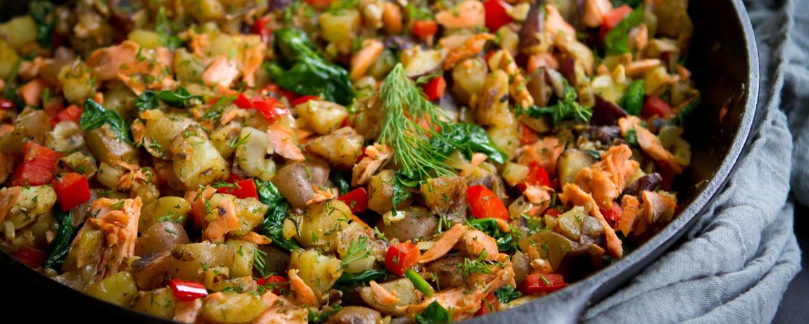 A salmon hash made in a cast iron skillet.