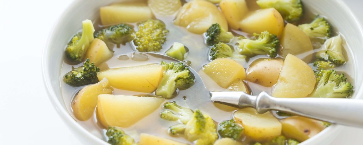 A bowl of broccoli potato soup.