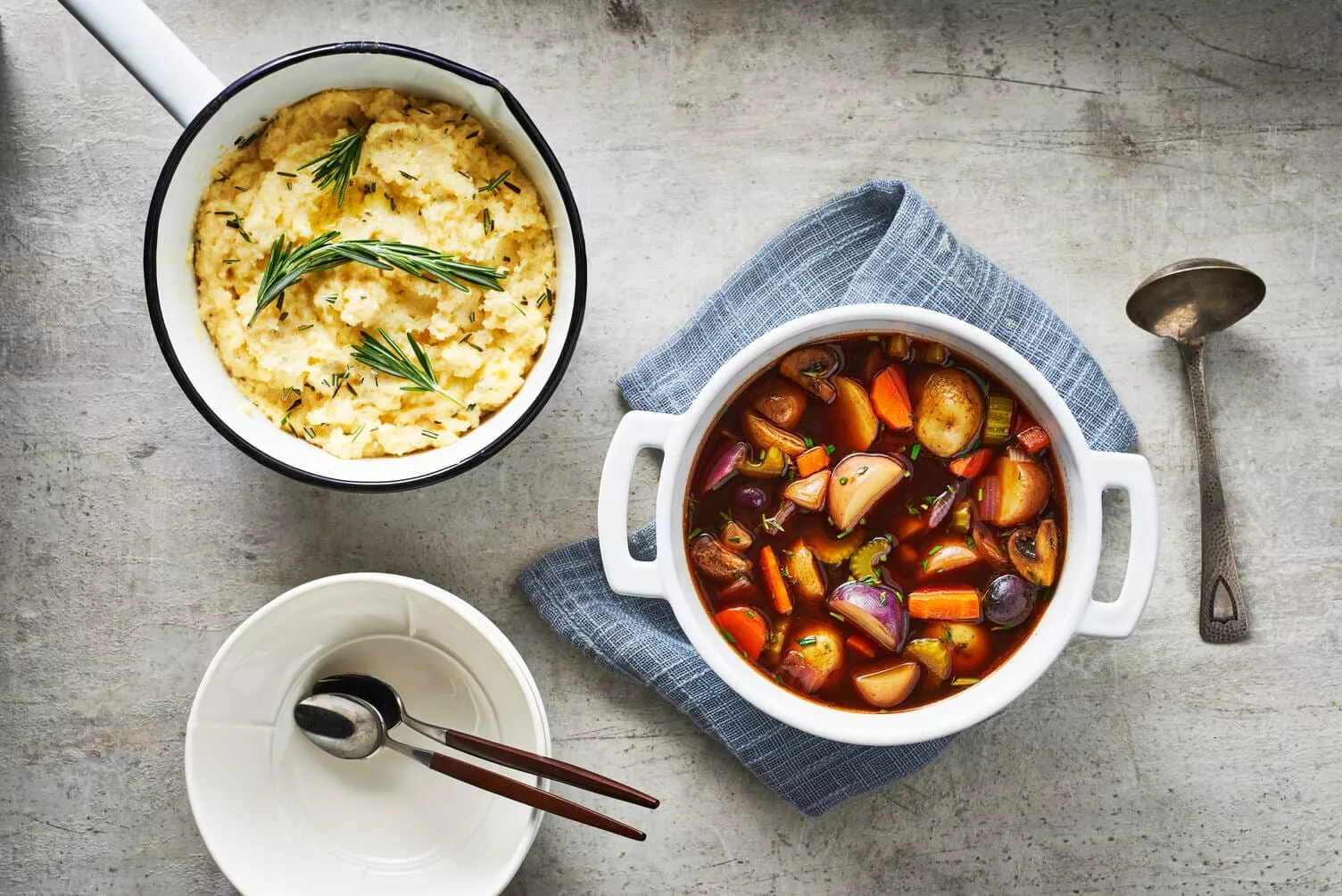 A delicious bowl of slow cooker veggie stew with polenta on the side.