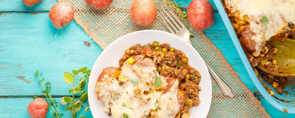 Smashed potato shepherd's pie in a serving dish and on a plate.