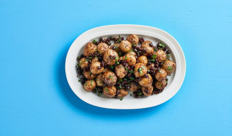 A plate of spicy black bean roasted potatoes