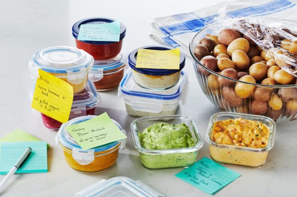 Labeled Tupperware containers with a bowl of the most delicious looking potatoes that have ever graced dishes.