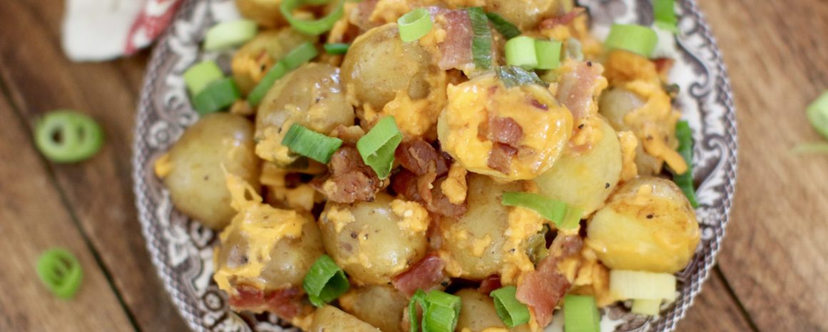 A bowl of loaded slow cooker little potatoes.