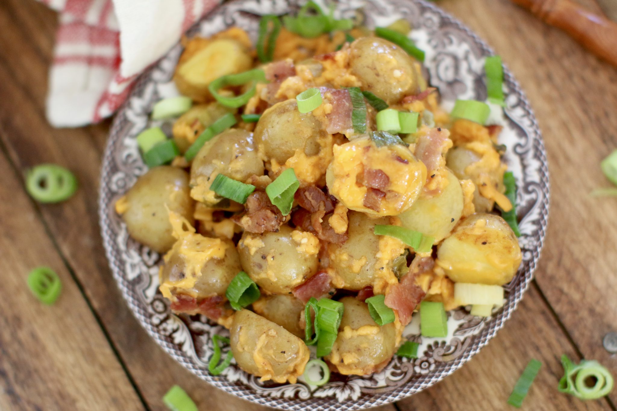A bowl of loaded slow cooker little potatoes.