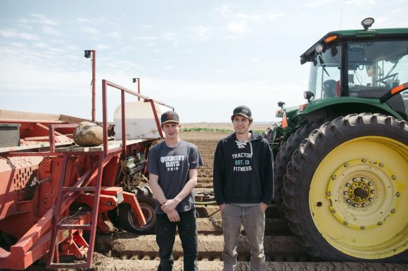 Niek and Ton in front of their tractors.
