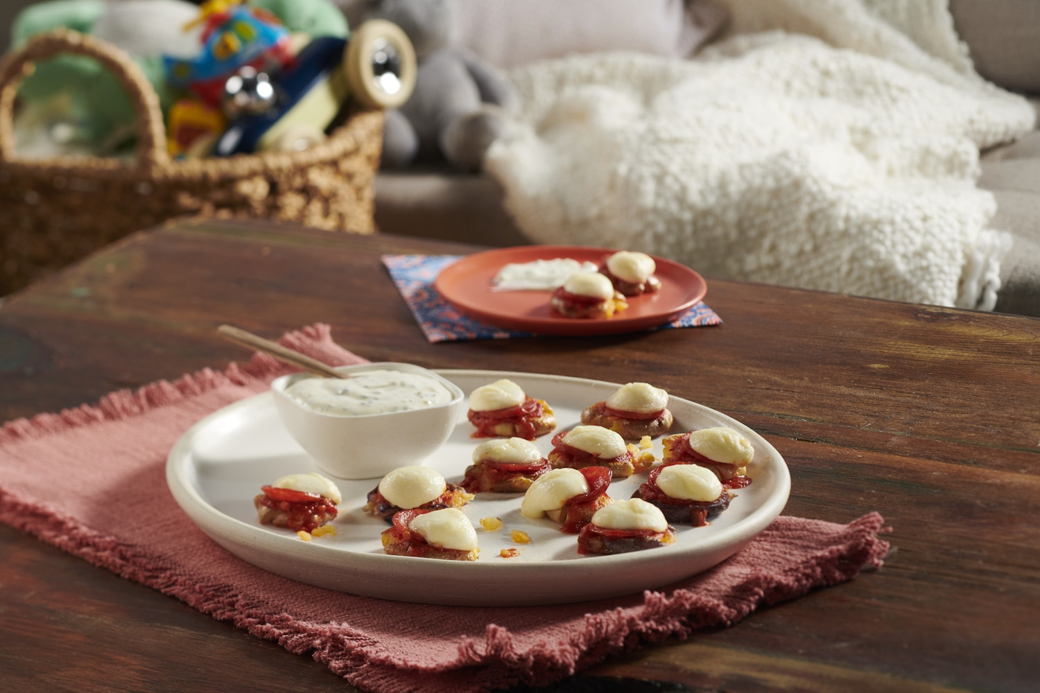 A plate of mini potato pizza bites.