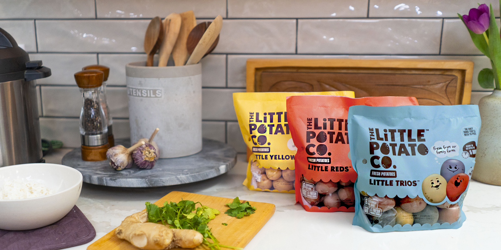 A kitchen counter featuring three bags of Little Yellows™, Little Reds™, and Little Trios™
