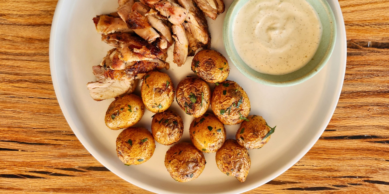 A plate of grilled chicken and Little Yellows™.