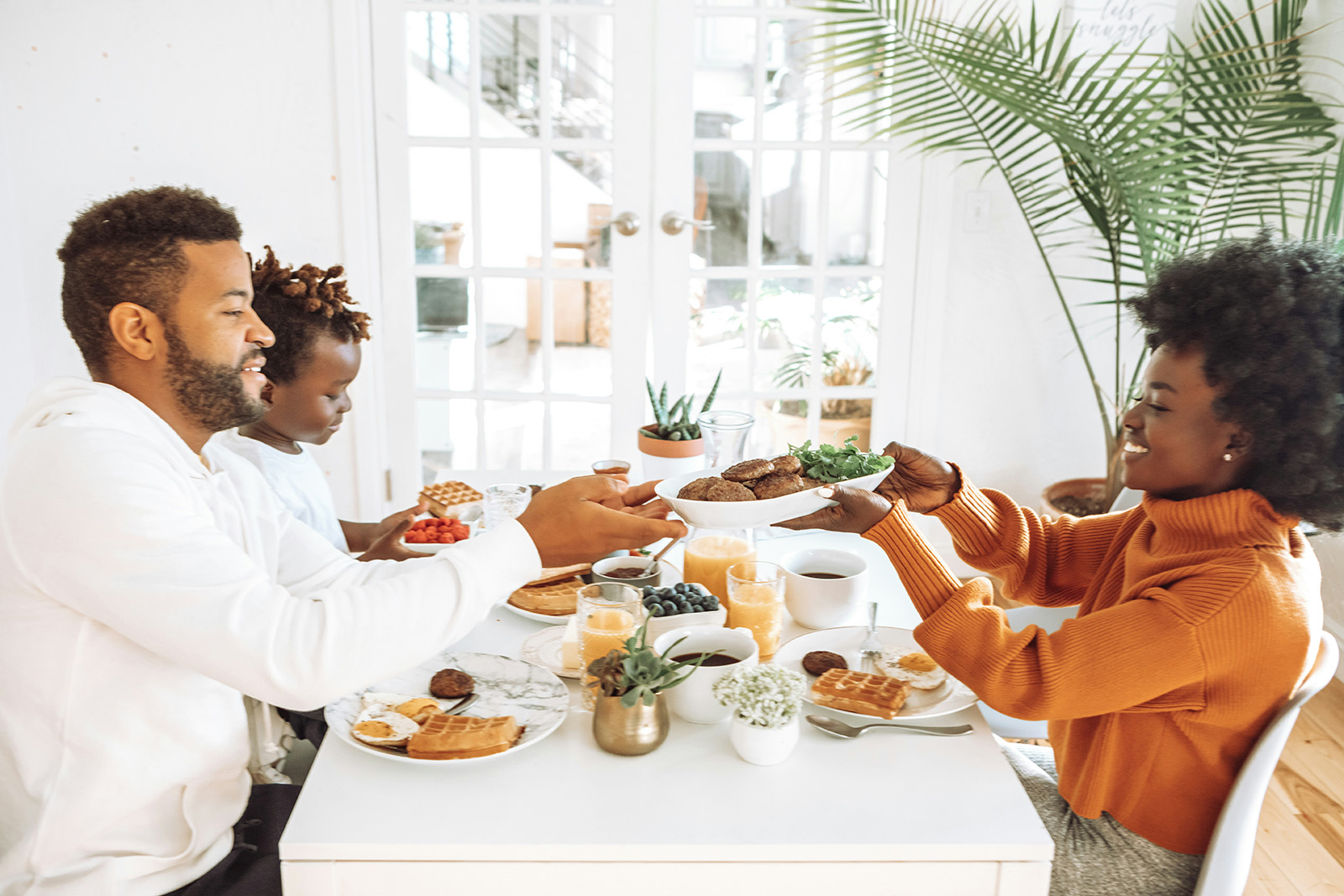 A family eating dinner together around the table.